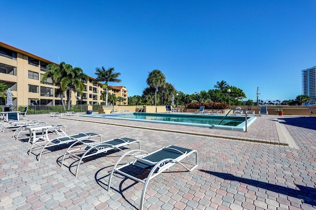 view of swimming pool featuring a patio area