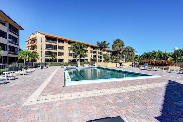 view of swimming pool featuring a patio area