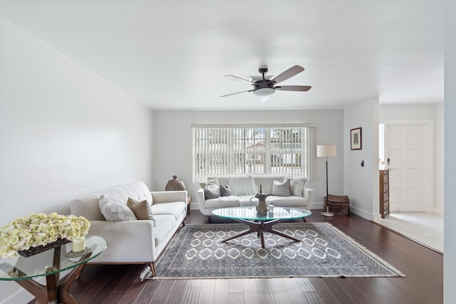 living room with ceiling fan and dark hardwood / wood-style floors