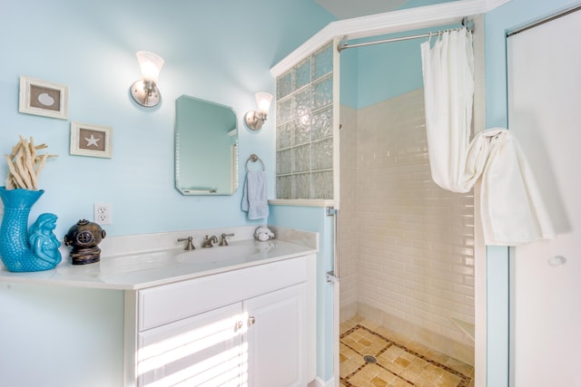 bathroom featuring vanity and curtained shower