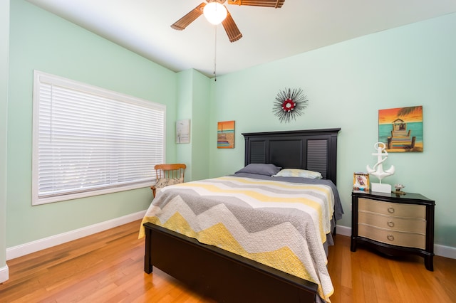 bedroom featuring ceiling fan and wood-type flooring