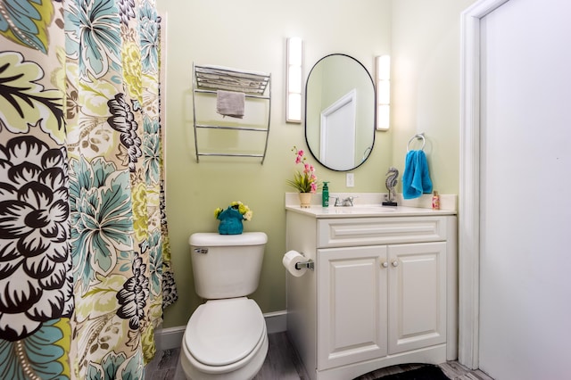 bathroom with toilet and vanity