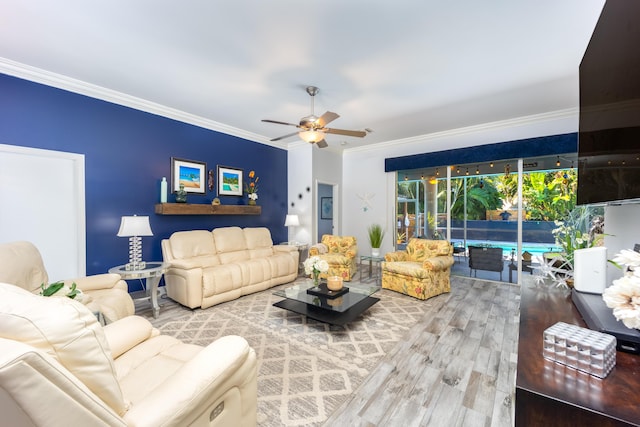 living room featuring ceiling fan, wood-type flooring, and ornamental molding