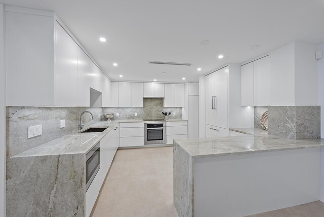 spare room with floor to ceiling windows, a wealth of natural light, and light tile patterned floors