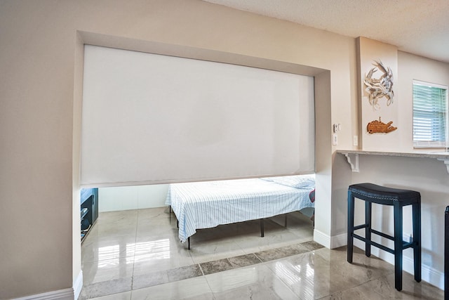 bedroom featuring a textured ceiling