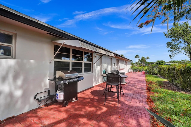 view of patio with a grill