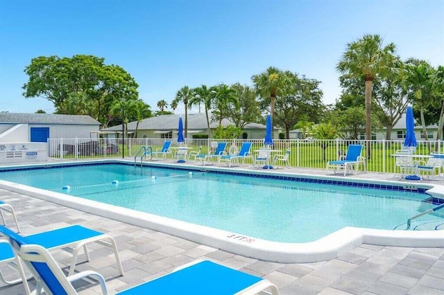 view of swimming pool featuring a patio