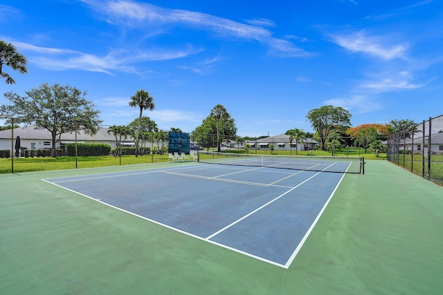 view of tennis court with basketball hoop