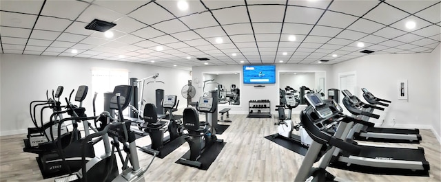 exercise room featuring light hardwood / wood-style flooring