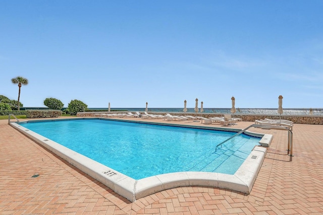 view of swimming pool with a patio area