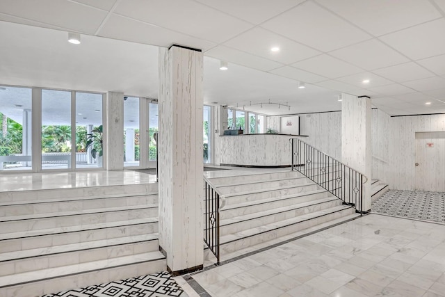 staircase with wooden walls