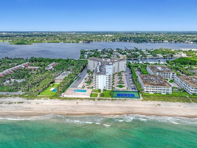 birds eye view of property featuring a water view and a view of the beach