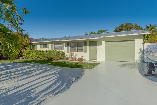 ranch-style home with a garage