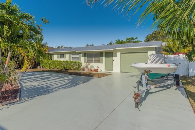 ranch-style house featuring a garage