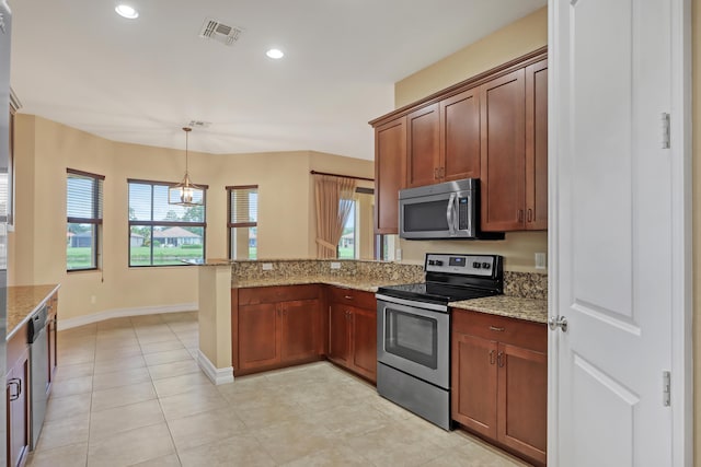 kitchen with light stone countertops, decorative light fixtures, stainless steel appliances, kitchen peninsula, and a notable chandelier