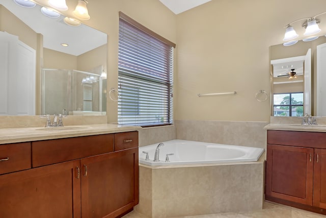 bathroom featuring ceiling fan, tile patterned flooring, vanity, and plus walk in shower