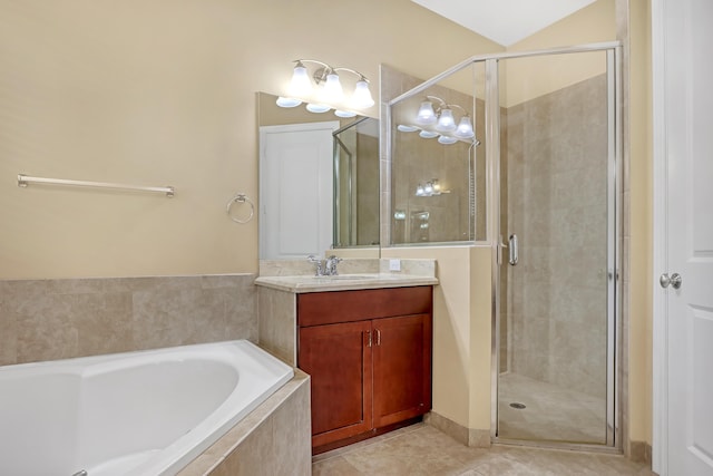 bathroom featuring vanity, tile patterned floors, and shower with separate bathtub