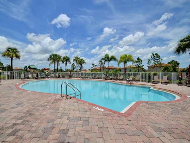 view of swimming pool with a patio area