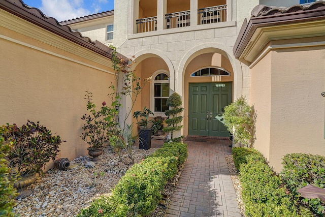 doorway to property featuring a balcony