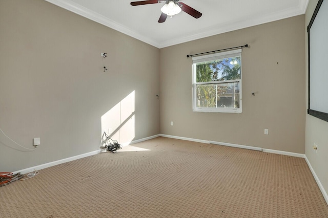 carpeted empty room with ornamental molding and ceiling fan