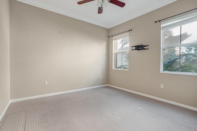 unfurnished room featuring carpet and ceiling fan