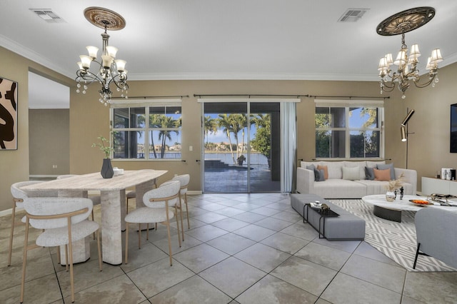 dining space featuring crown molding, light tile patterned flooring, and a notable chandelier