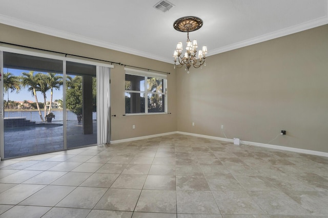 spare room featuring an inviting chandelier, light tile patterned floors, ornamental molding, and a water view