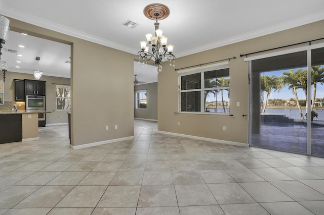 unfurnished dining area with sink, crown molding, a notable chandelier, and light tile patterned flooring