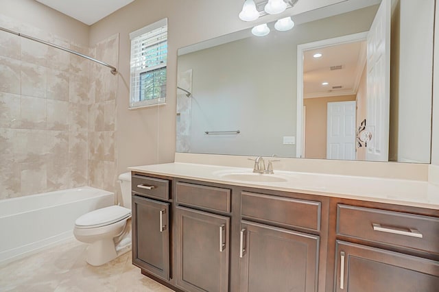 full bathroom with crown molding, tile patterned flooring, tiled shower / bath combo, vanity, and toilet