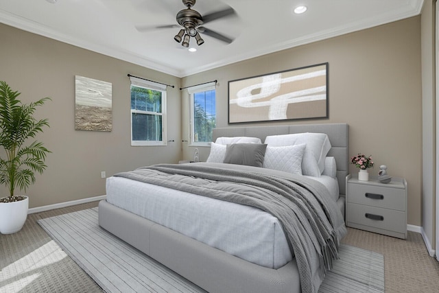 bedroom with ornamental molding and ceiling fan