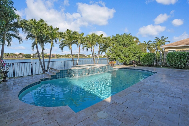 view of swimming pool featuring an in ground hot tub, a water view, pool water feature, and a patio area