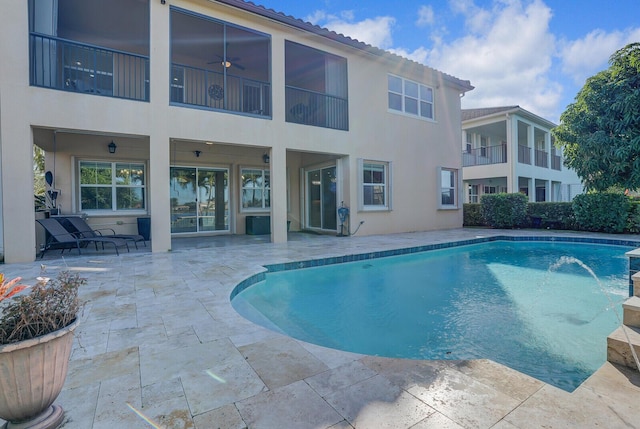 view of pool with ceiling fan