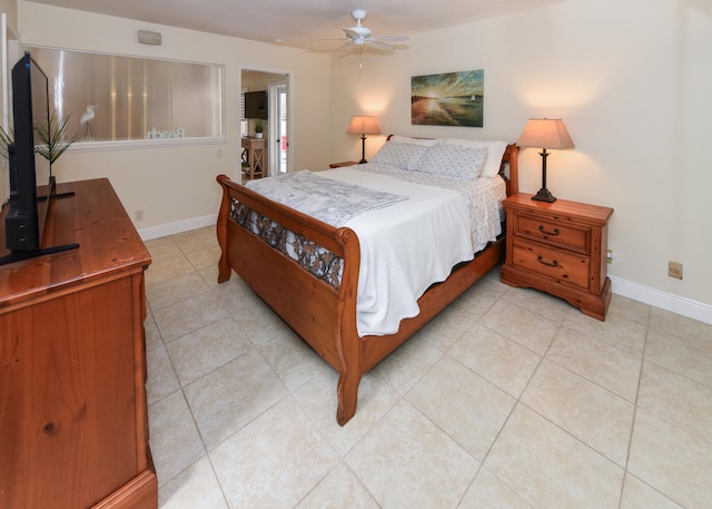 tiled bedroom featuring ceiling fan