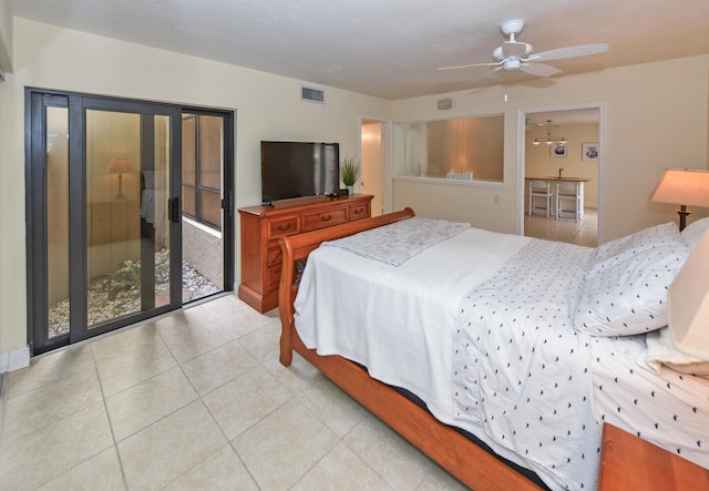 bedroom with ceiling fan and light tile patterned floors