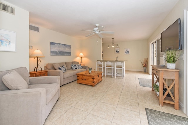 tiled living room featuring ceiling fan