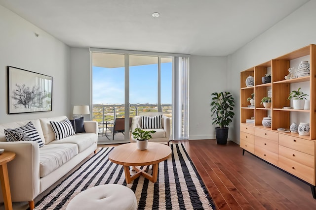 living room with expansive windows and dark hardwood / wood-style floors