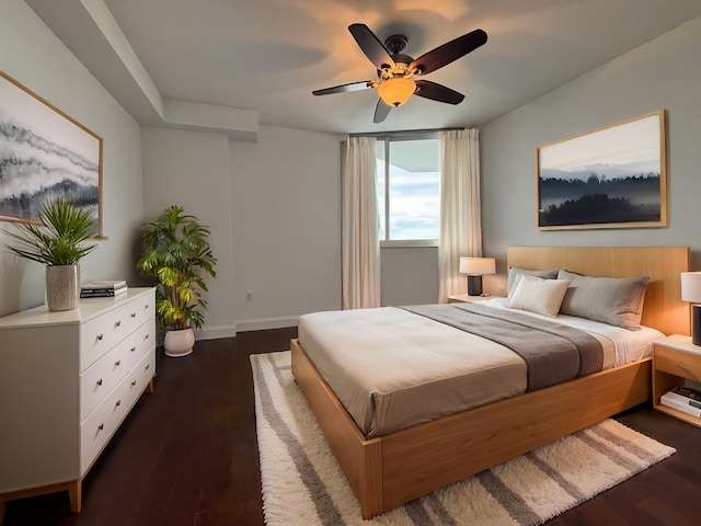 bedroom with ceiling fan and dark hardwood / wood-style flooring