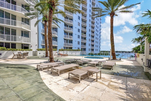 view of patio featuring a community pool