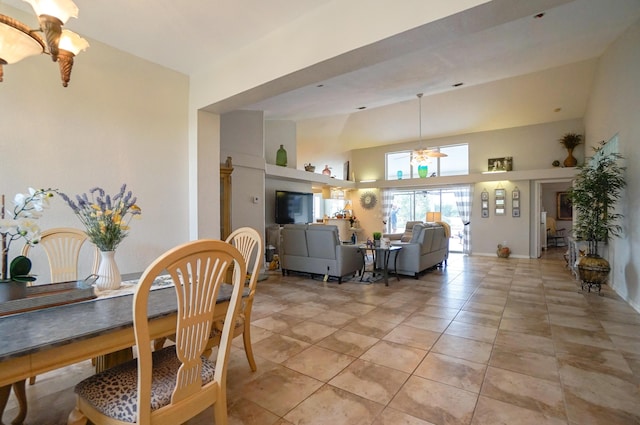 tiled dining room featuring a towering ceiling