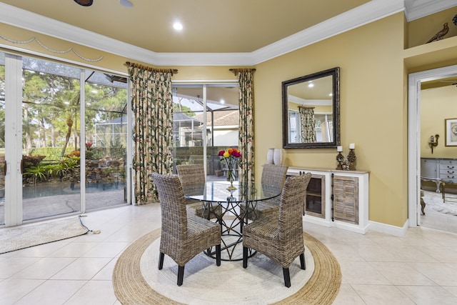 tiled dining space featuring crown molding