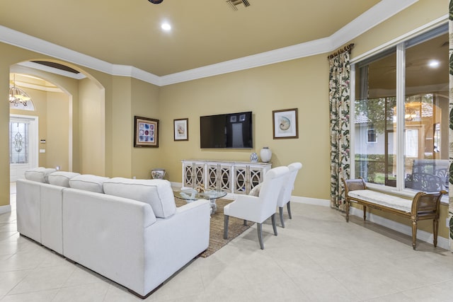 living room featuring light tile patterned floors, a notable chandelier, and crown molding