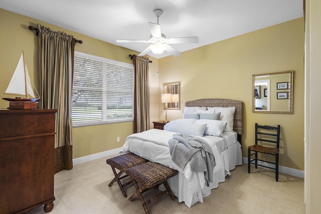 bedroom featuring ceiling fan and light tile patterned floors