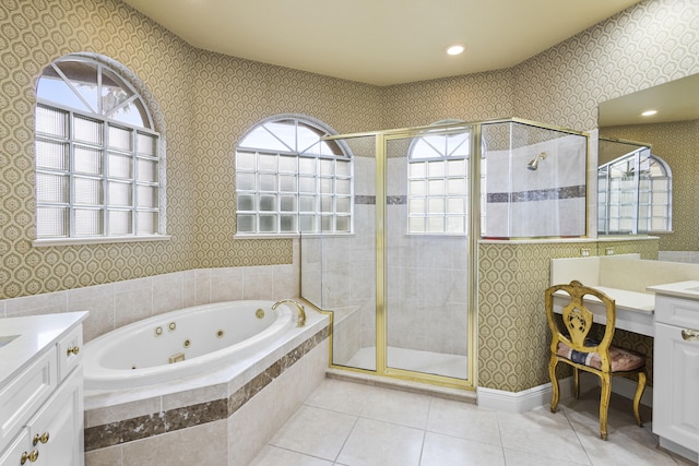 bathroom with vanity, tile patterned floors, and plus walk in shower