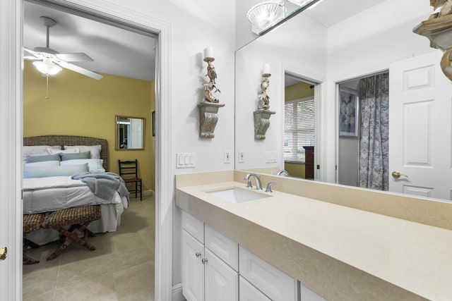 bathroom featuring ceiling fan, tile patterned floors, and vanity