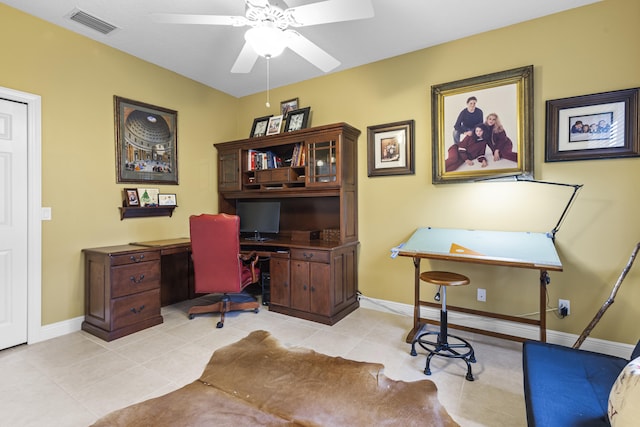 tiled home office featuring ceiling fan