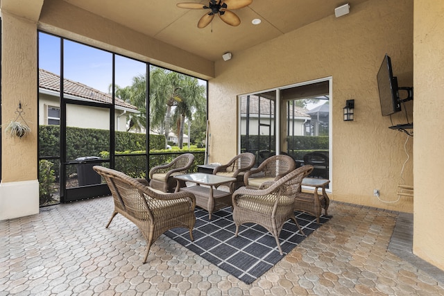 sunroom / solarium with ceiling fan and a healthy amount of sunlight