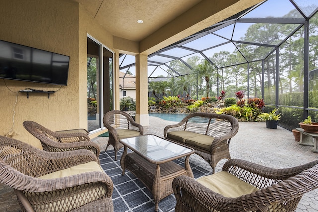 view of patio / terrace featuring glass enclosure and outdoor lounge area