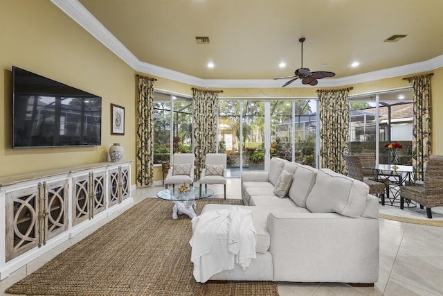 living room with ceiling fan, light tile patterned flooring, and ornamental molding