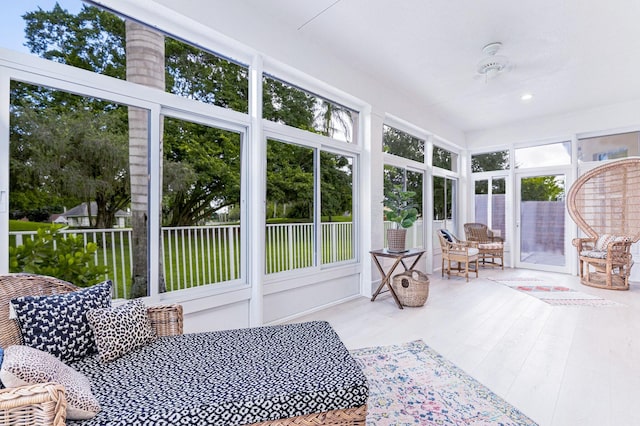 sunroom / solarium with ceiling fan