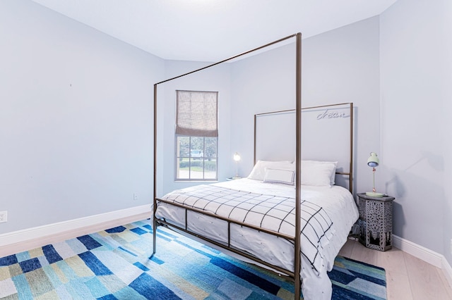 bedroom with wood-type flooring